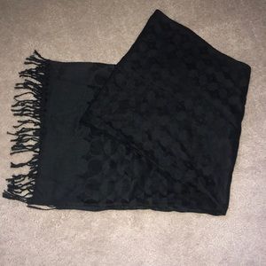Black scarf with design.